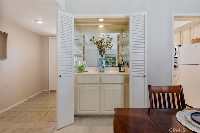 5520 Via La Mesa Unit A, Laguna Woods, CA 92637 - kitchen featuring freestanding refrigerator, light countertops, light tile patterned floors, and recessed lighting