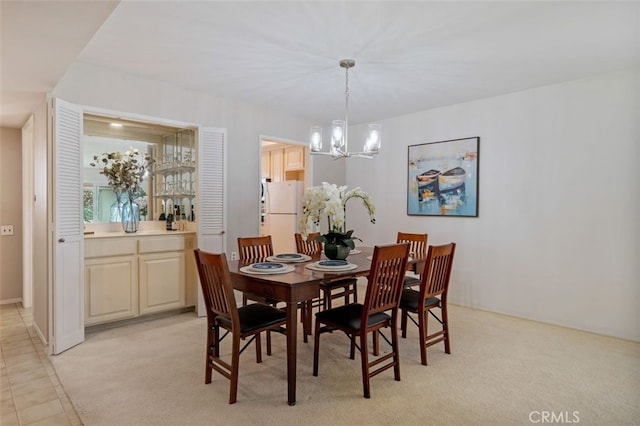 5520 Via La Mesa Unit A, Laguna Woods, CA 92637 - dining room featuring a chandelier and light colored carpet