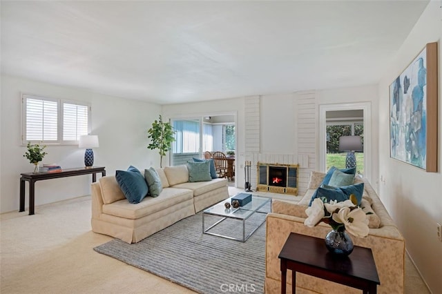 5520 Via La Mesa Unit A, Laguna Woods, CA 92637 - carpeted living room with plenty of natural light and a fireplace
