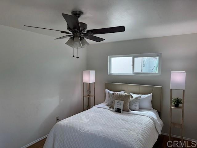 4454 Ute Dr, San Diego, CA 92117 - bedroom with a ceiling fan and dark wood-type flooring