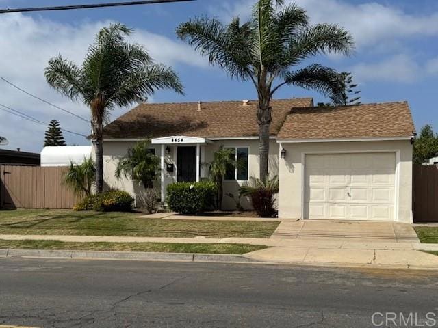 4454 Ute Dr, San Diego, CA 92117 - ranch-style house featuring a garage, stucco siding, and concrete driveway