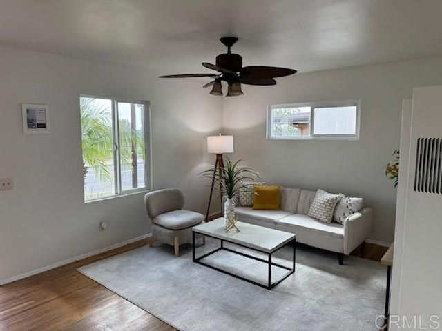 4454 Ute Dr, San Diego, CA 92117 - living room with wood finished floors and a ceiling fan