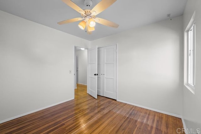 4454 Ute Dr, San Diego, CA 92117 - unfurnished bedroom featuring wood finished floors, a closet, and a ceiling fan