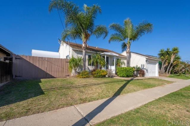 4454 Ute Dr, San Diego, CA 92117 - view of front facade featuring a garage, stucco siding, and driveway