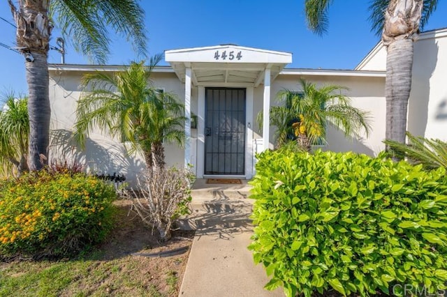 4454 Ute Dr, San Diego, CA 92117 - entrance to property with stucco siding