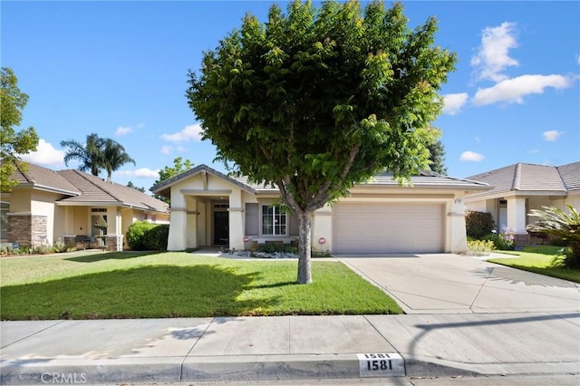 1581 Manor Ln, Glendora, CA 91741 - view of front of home featuring an attached garage, concrete driveway, stucco siding, and a front lawn