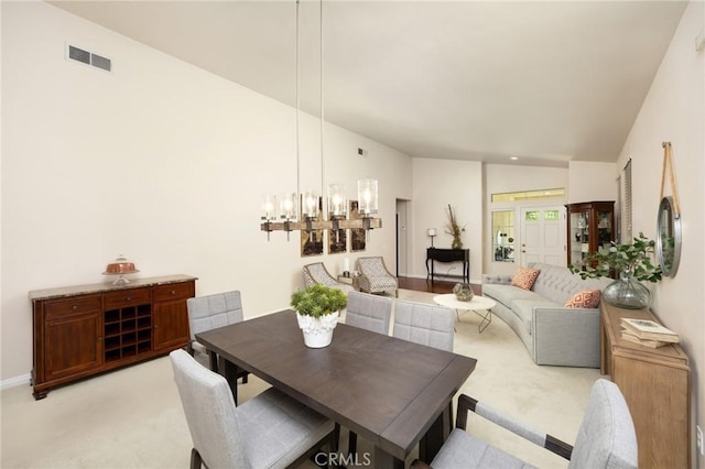 1581 Manor Ln, Glendora, CA 91741 - dining area with lofted ceiling, light carpet, and a chandelier