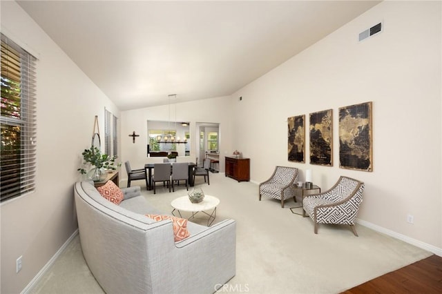 1581 Manor Ln, Glendora, CA 91741 - carpeted living area featuring lofted ceiling, wood finished floors, and a chandelier
