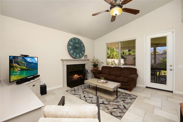 1581 Manor Ln, Glendora, CA 91741 - living area with vaulted ceiling, a warm lit fireplace, and a ceiling fan