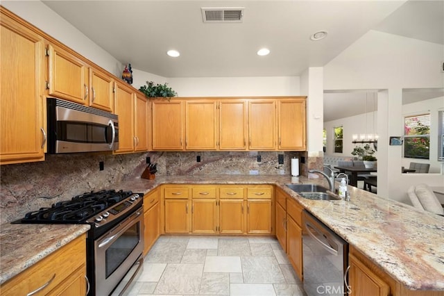 1581 Manor Ln, Glendora, CA 91741 - kitchen featuring appliances with stainless steel finishes, decorative backsplash, light stone countertops, a peninsula, and recessed lighting