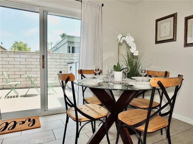 16573 Pescado Ln Unit 3A, Huntington Beach, CA 92649 - dining area with light tile patterned floors and baseboards
