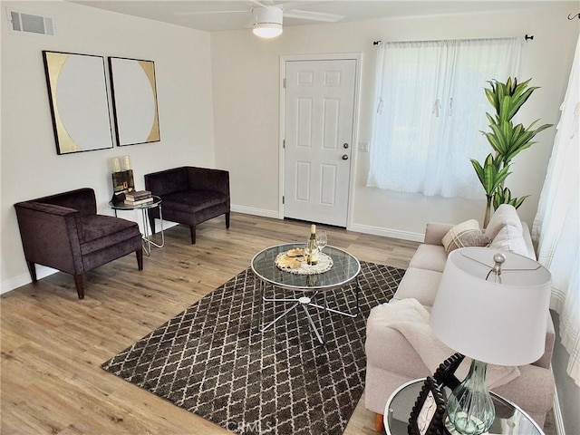 16573 Pescado Ln Unit 3A, Huntington Beach, CA 92649 - living room featuring wood finished floors and a ceiling fan