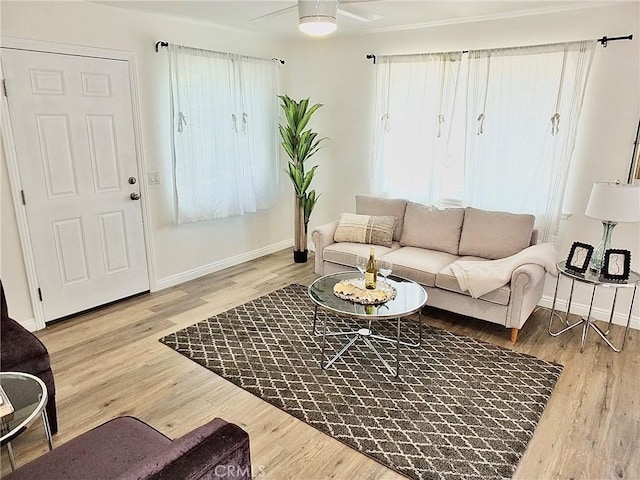 16573 Pescado Ln Unit 3A, Huntington Beach, CA 92649 - living room featuring plenty of natural light, ceiling fan, and wood finished floors