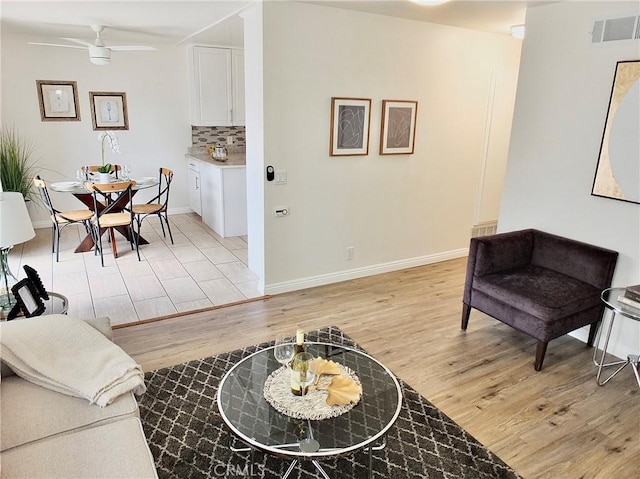 16573 Pescado Ln Unit 3A, Huntington Beach, CA 92649 - living area with light wood-style flooring and ceiling fan