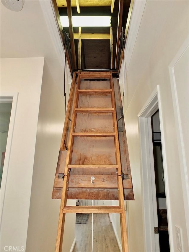 16573 Pescado Ln Unit 3A, Huntington Beach, CA 92649 - staircase featuring wood finished floors