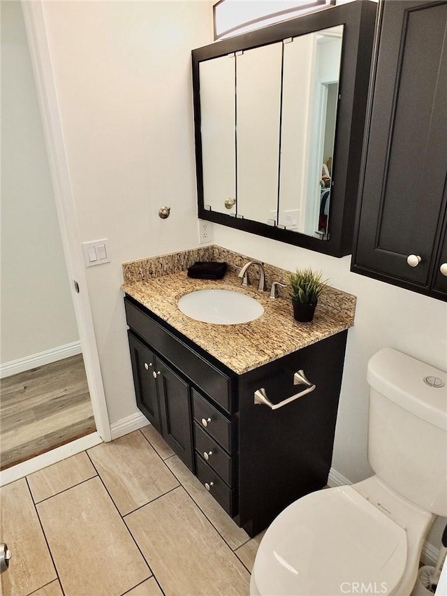 16573 Pescado Ln Unit 3A, Huntington Beach, CA 92649 - half bath featuring vanity and toilet