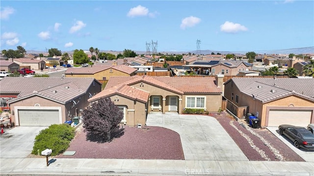 16029 Carmelia Dr, Victorville, CA 92394 - mediterranean / spanish-style home with a residential view, driveway, stucco siding, and a tile roof