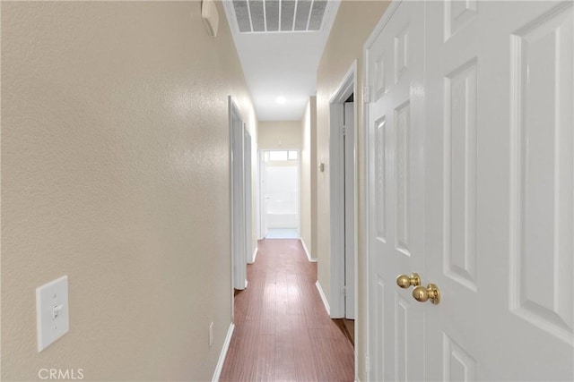 16029 Carmelia Dr, Victorville, CA 92394 - hall with dark wood finished floors and a textured wall