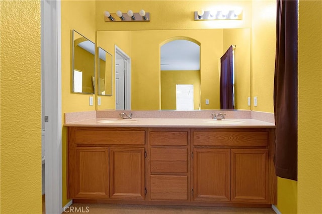 16029 Carmelia Dr, Victorville, CA 92394 - bathroom featuring double vanity and a textured wall