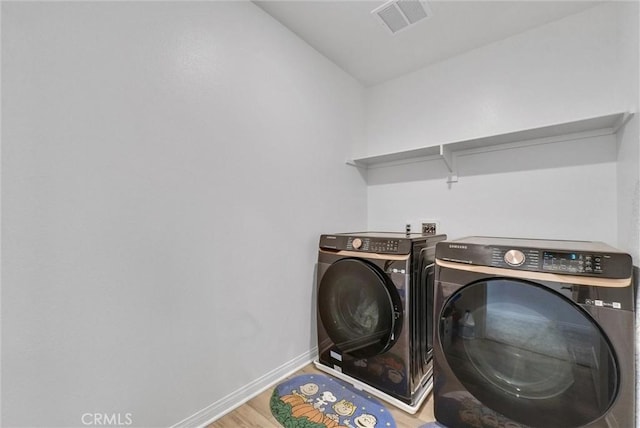 34410 Granite Rd, Yucaipa, CA 92399 - washroom featuring washing machine and dryer and wood finished floors