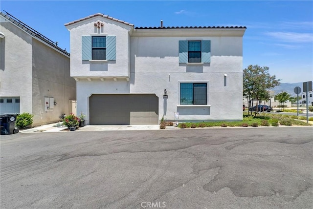 34410 Granite Rd, Yucaipa, CA 92399 - view of front of property with stucco siding, an attached garage, driveway, and a tiled roof