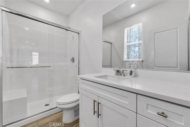 34410 Granite Rd, Yucaipa, CA 92399 - full bathroom featuring a shower stall, vanity, wood finished floors, and recessed lighting