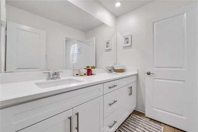 34410 Granite Rd, Yucaipa, CA 92399 - bathroom with double vanity, recessed lighting, and wood finished floors