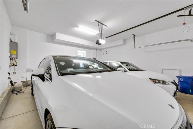 34410 Granite Rd, Yucaipa, CA 92399 - garage with a garage door opener, water heater, and washer and clothes dryer