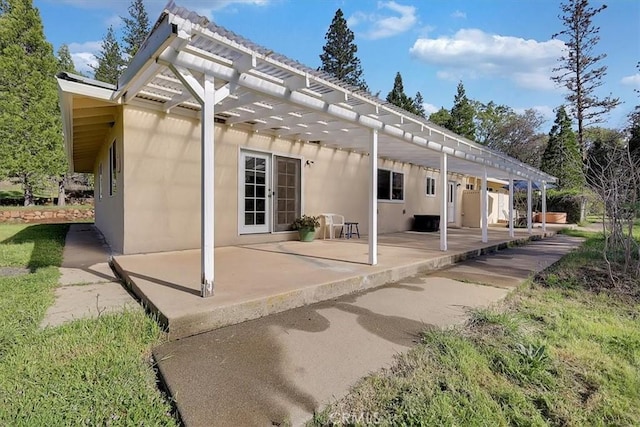 13001 Yuba Nevada Rd, Dobbins, CA 95935 - back of house with a pergola, a patio, and stucco siding