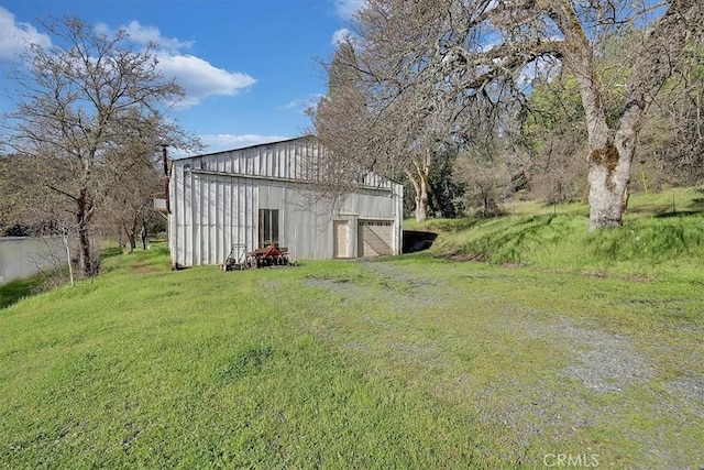 13001 Yuba Nevada Rd, Dobbins, CA 95935 - view of green lawn with an outbuilding and a garage