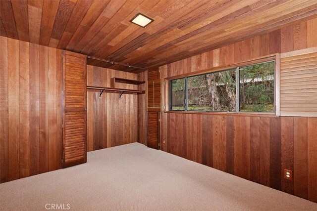 29240 Palos Verdes Dr E, Rancho Palos Verdes, CA 90275 - unfurnished bedroom featuring wood walls, multiple windows, wood ceiling, and carpet floors