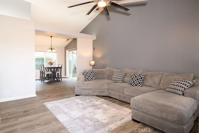 1085 Admiral Ln, Chico, CA 95973 - living room featuring wood finished floors, ceiling fan, a chandelier, and high vaulted ceiling