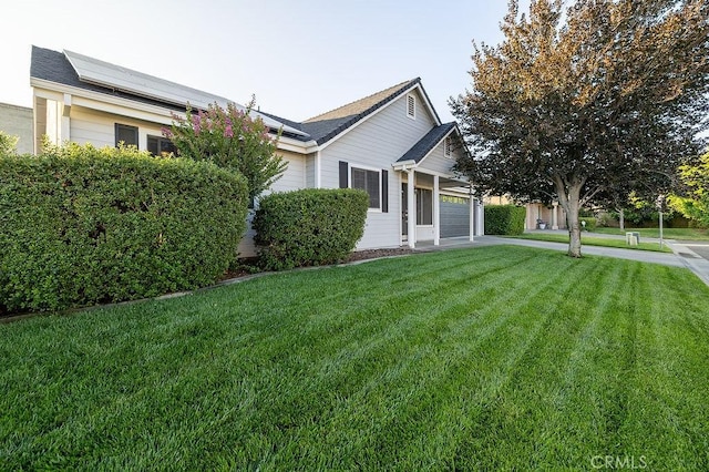 1085 Admiral Ln, Chico, CA 95973 - view of home's exterior featuring an attached garage, a lawn, and driveway