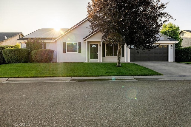 1085 Admiral Ln, Chico, CA 95973 - view of front of home with an attached garage, driveway, and a front lawn