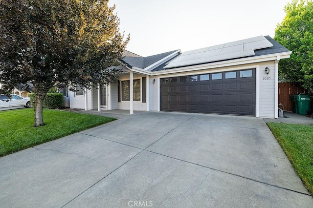 1085 Admiral Ln, Chico, CA 95973 - single story home featuring concrete driveway, solar panels, an attached garage, covered porch, and roof with shingles