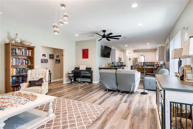 7002 Alice St, Highland, CA 92346 - living area featuring light wood-type flooring, a ceiling fan, and recessed lighting