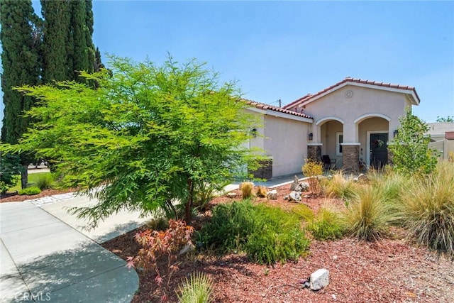 7002 Alice St, Highland, CA 92346 - view of front of house featuring stucco siding and a tile roof