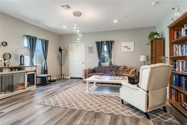 7002 Alice St, Highland, CA 92346 - living area featuring wood finished floors and recessed lighting