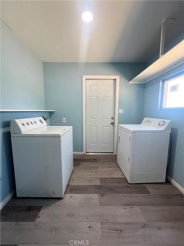 54279 Bautista Canyond Rd, Anza, CA 92539 - laundry area featuring washing machine and dryer and light wood-style flooring