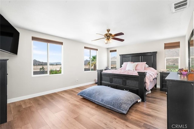 3094 Crooked Branch Way, San Jacinto, CA 92582 - bedroom featuring multiple windows, wood finished floors, and a ceiling fan