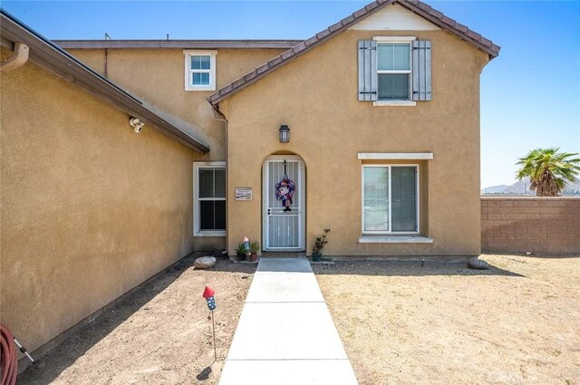 3094 Crooked Branch Way, San Jacinto, CA 92582 - doorway to property featuring stucco siding