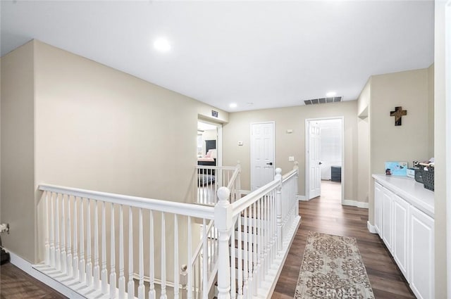 3094 Crooked Branch Way, San Jacinto, CA 92582 - corridor featuring an upstairs landing, dark wood-style floors, and recessed lighting