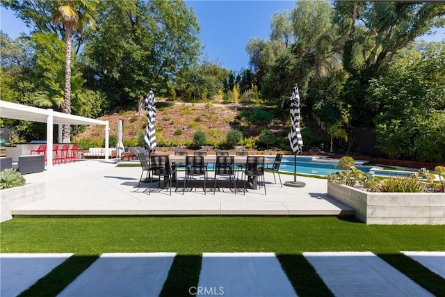 19258 Berclair Ln, Tarzana, CA 91356 - view of patio / terrace with an outdoor pool and view of scattered trees