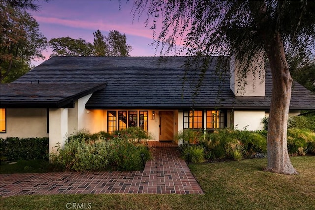 19258 Berclair Ln, Tarzana, CA 91356 - view of front of house featuring stucco siding and a front yard
