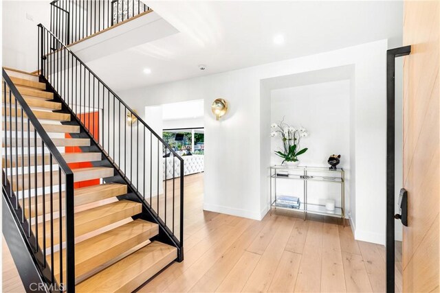 19258 Berclair Ln, Tarzana, CA 91356 - staircase with wood-type flooring and recessed lighting