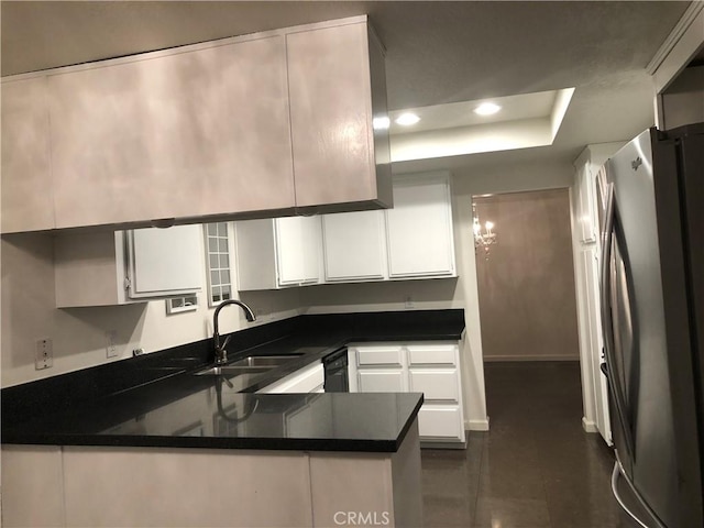 2545 Via Campesina Unit 102, Palos Verdes Estates, CA 90274 - kitchen with freestanding refrigerator, a peninsula, white cabinets, recessed lighting, and dark countertops
