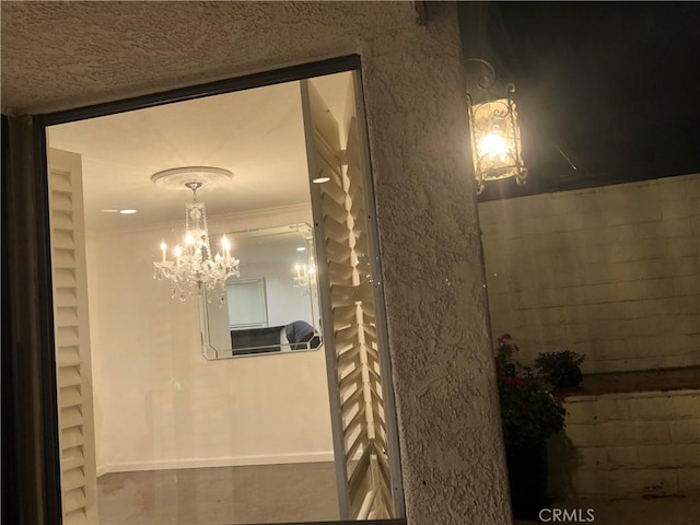 2545 Via Campesina Unit 102, Palos Verdes Estates, CA 90274 - hallway with a chandelier and baseboards