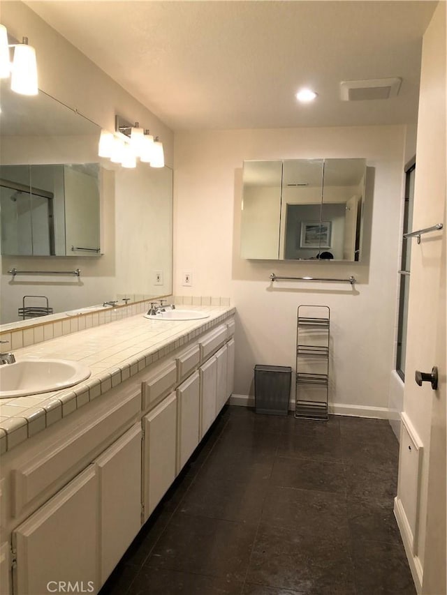 2545 Via Campesina Unit 102, Palos Verdes Estates, CA 90274 - full bathroom featuring double vanity, shower / bath combination, recessed lighting, and tile patterned flooring
