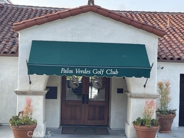 2545 Via Campesina Unit 102, Palos Verdes Estates, CA 90274 - entrance to property featuring a tile roof and stucco siding