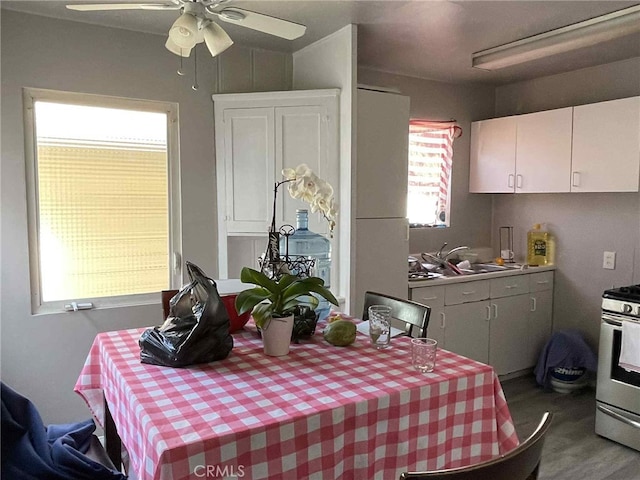 9051 Walker St, Cypress, CA 90630 - dining space with ceiling fan and wood finished floors